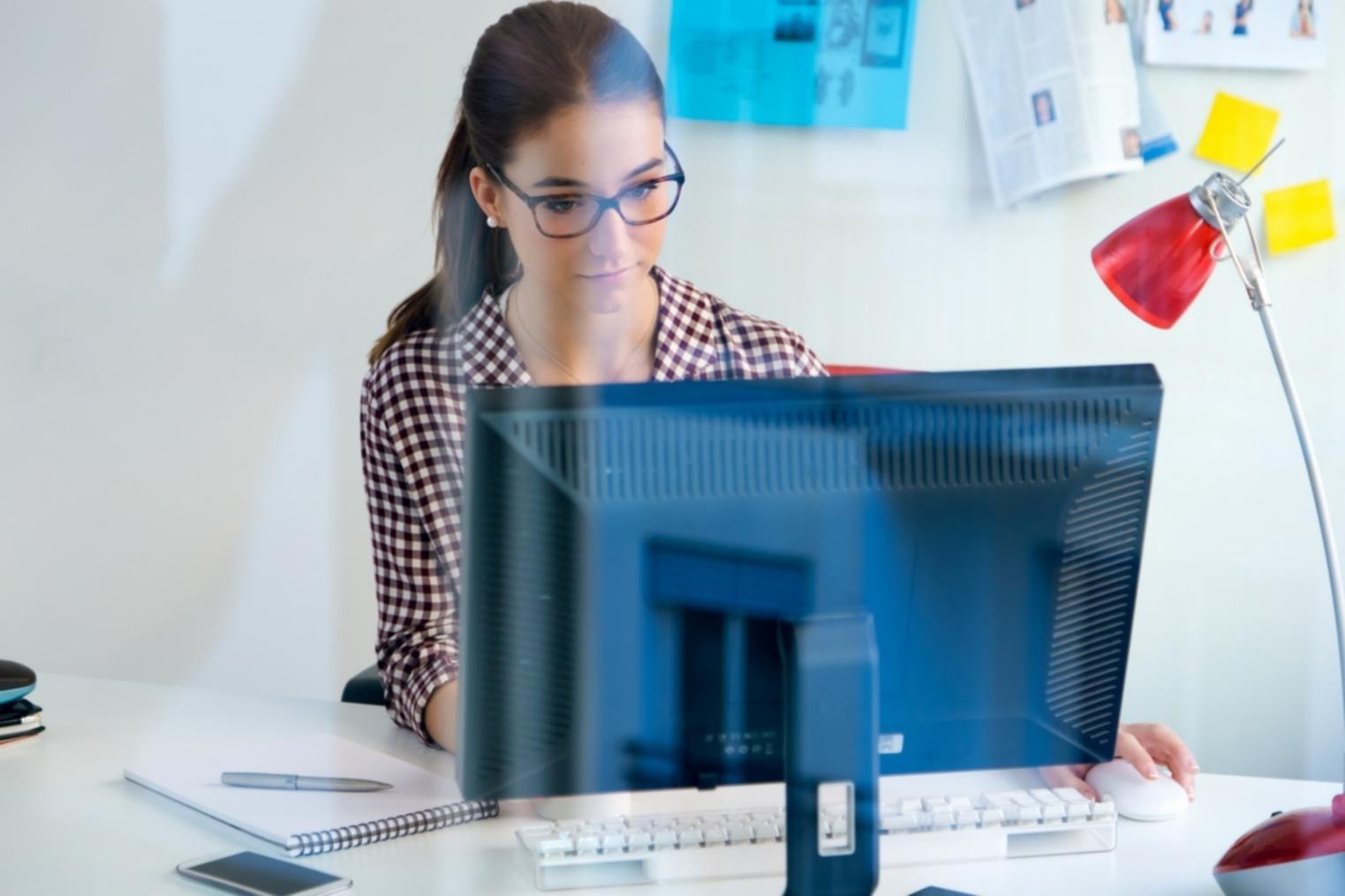 Students collaborating on blockchain project with laptops and whiteboard diagrams